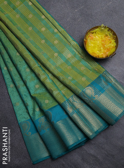 Semi raw silk saree dual shade of teal bluish green and teal green with allover prints & 1000 zari buttas and zari woven border