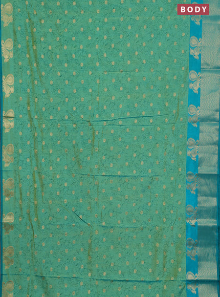 Semi raw silk saree dual shade of teal bluish green and teal green with allover prints & 1000 zari buttas and zari woven border