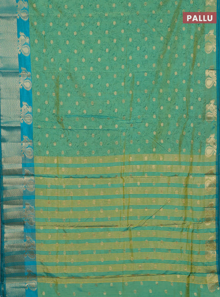 Semi raw silk saree dual shade of teal bluish green and teal green with allover prints & 1000 zari buttas and zari woven border