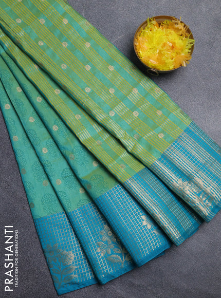 Semi raw silk saree dual shade of teal bluish green and teal blue with allover floral butta prints & 1000 zari buttas and long zari woven border