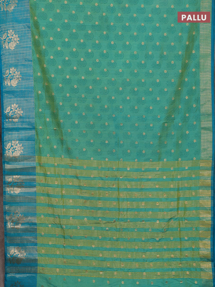 Semi raw silk saree dual shade of teal bluish green and teal blue with allover floral butta prints & 1000 zari buttas and long zari woven border