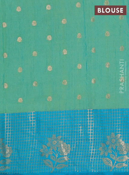 Semi raw silk saree dual shade of teal bluish green and teal blue with allover floral butta prints & 1000 zari buttas and long zari woven border