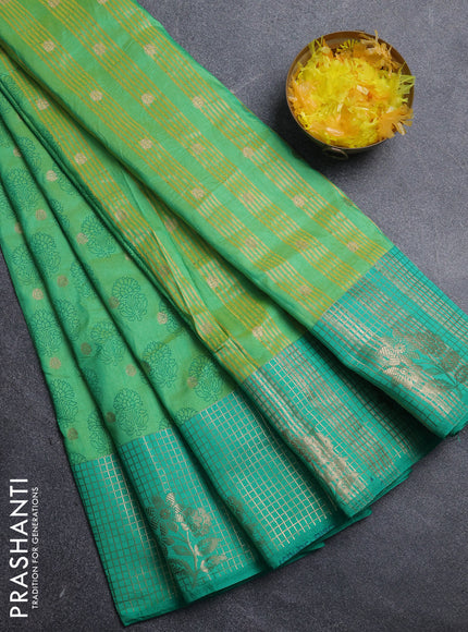 Semi raw silk saree dual shade of green and teal green with allover floral butta prints & 1000 zari buttas and long zari woven border