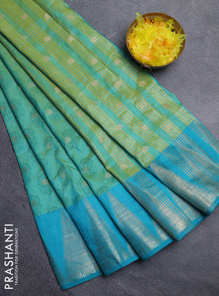 Semi raw silk saree dual shade of teal blue and cs blue with allover floral butta prints & 1000 zari buttas and temple design zari woven border