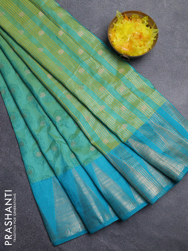 Semi raw silk saree dual shade of teal blue and cs blue with allover floral butta prints & 1000 zari buttas and temple design zari woven border