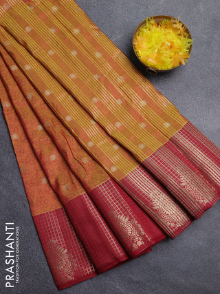 Semi raw silk saree dual shade of dark mustard and maroon with allover floral prints & 1000 zari buttas and long zari woven border