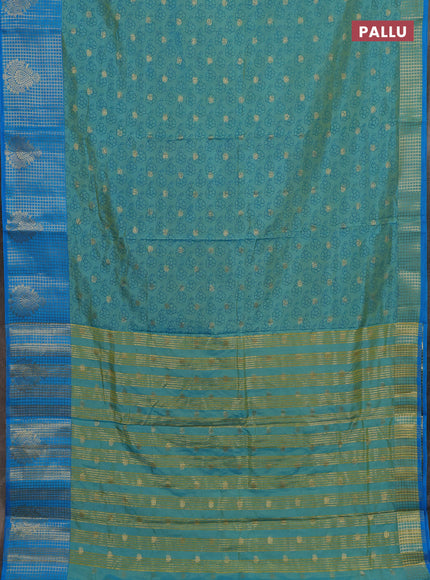 Semi raw silk saree dual shade of teal bluish green and cs blue with allover floral prints & 1000 zari buttas and long zari woven border