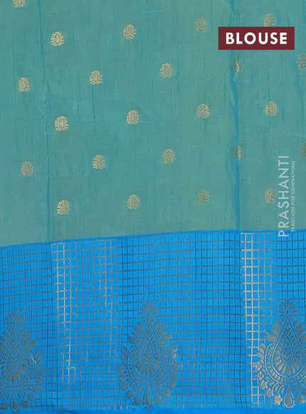 Semi raw silk saree dual shade of teal bluish green and cs blue with allover floral prints & 1000 zari buttas and long zari woven border