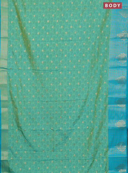 Semi raw silk saree dual shade of teal bluish green and teal blue with allover floral prints & 1000 zari buttas and long zari woven border