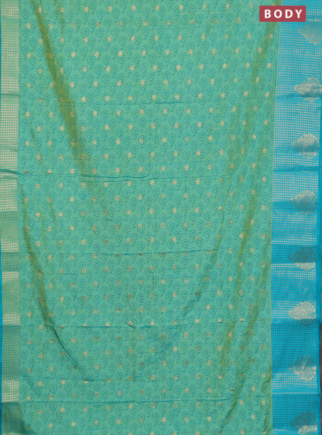 Semi raw silk saree dual shade of teal bluish green and teal blue with allover floral prints & 1000 zari buttas and long zari woven border