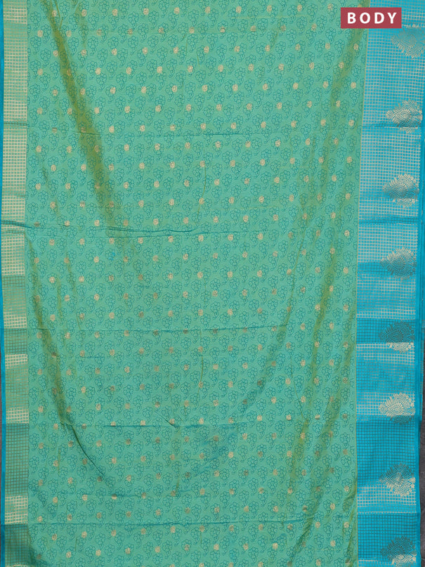Semi raw silk saree dual shade of teal bluish green and teal blue with allover floral prints & 1000 zari buttas and long zari woven border