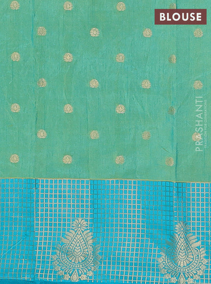 Semi raw silk saree dual shade of teal bluish green and teal blue with allover floral prints & 1000 zari buttas and long zari woven border