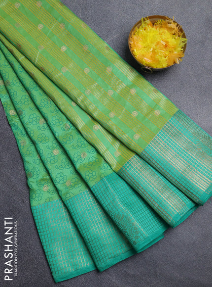 Semi raw silk saree light green and green with allover floral prints & 1000 zari buttas and long zari woven border