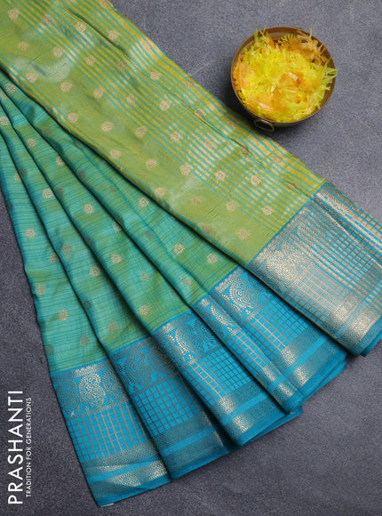 Semi raw silk saree dual shade of teal bluish green and teal blue with allover prints & 1000 zari buttas and long zari woven border