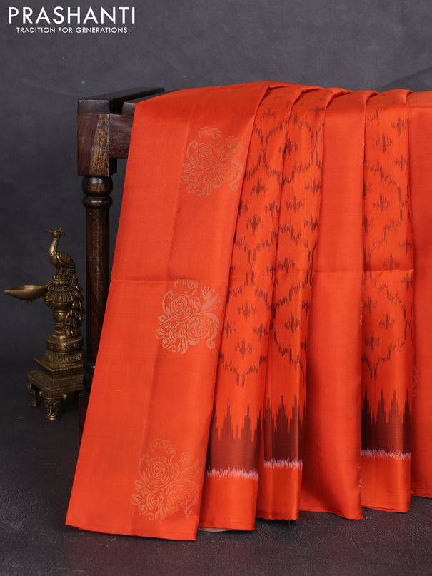 Ikat soft silk saree orange and pastel brown with allover ikat weaves & zari buttas and simple border