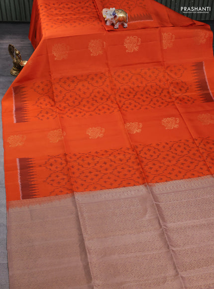 Ikat soft silk saree orange and pastel brown with allover ikat weaves & zari buttas and simple border