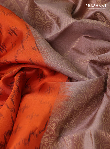 Ikat soft silk saree orange and pastel brown with allover ikat weaves & zari buttas and simple border