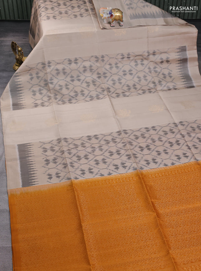 Ikat soft silk saree beige and dark mustard with allover ikat weaves & zari buttas and simple border