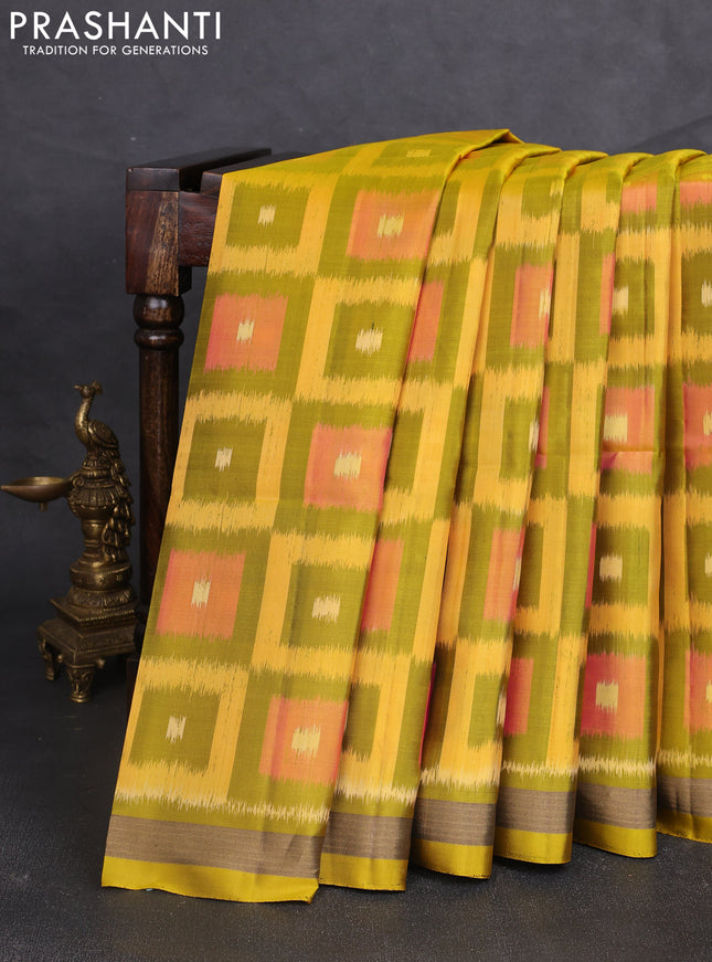 Ikat soft silk saree mustard green and yellow with allover ikat checks buttas and zari woven border