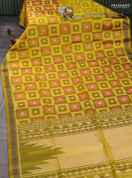 Ikat soft silk saree mustard green and yellow with allover ikat checks buttas and zari woven border