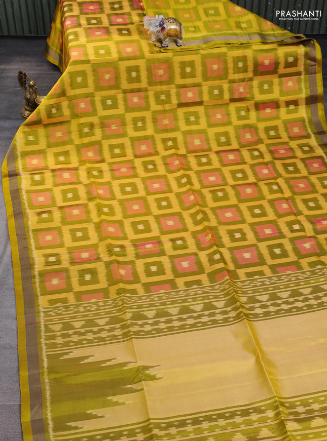 Ikat soft silk saree mustard green and yellow with allover ikat checks buttas and zari woven border