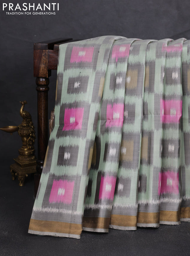 Ikat soft silk saree pastel green and grey with allover ikat woven buttas and zari woven border