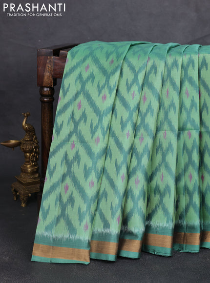 Ikat soft silk saree teal green with allover ikat weaves and zari woven border