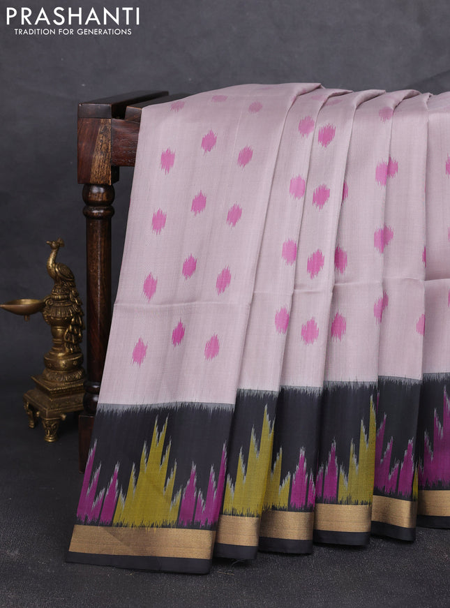 Ikat soft silk saree pastel grey and black with allover ikat woven buttas and temple design zari woven border