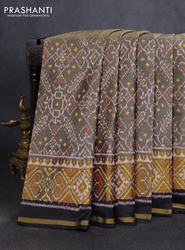 Rajkot patola silk saree elachi green and black with allover ikat weaves and zari woven border