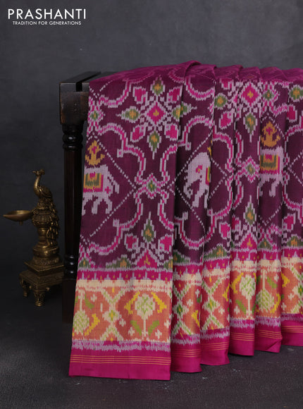 Rajkot patola silk saree magenta pink and blue with allover ikat weaves and ikat zari woven border