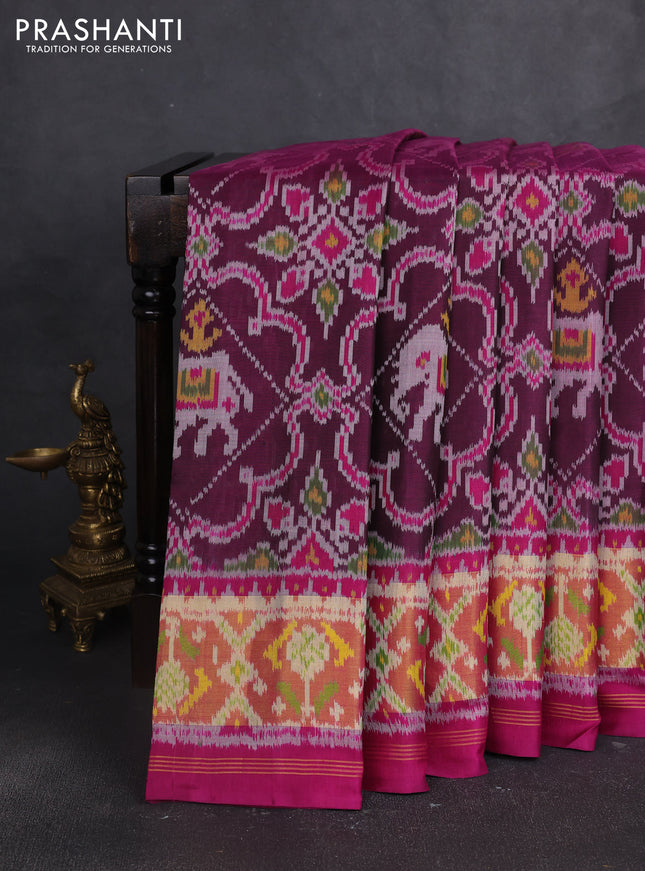Rajkot patola silk saree magenta pink and blue with allover ikat weaves and ikat zari woven border