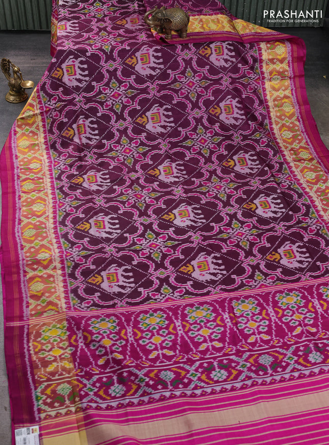 Rajkot patola silk saree magenta pink and blue with allover ikat weaves and ikat zari woven border