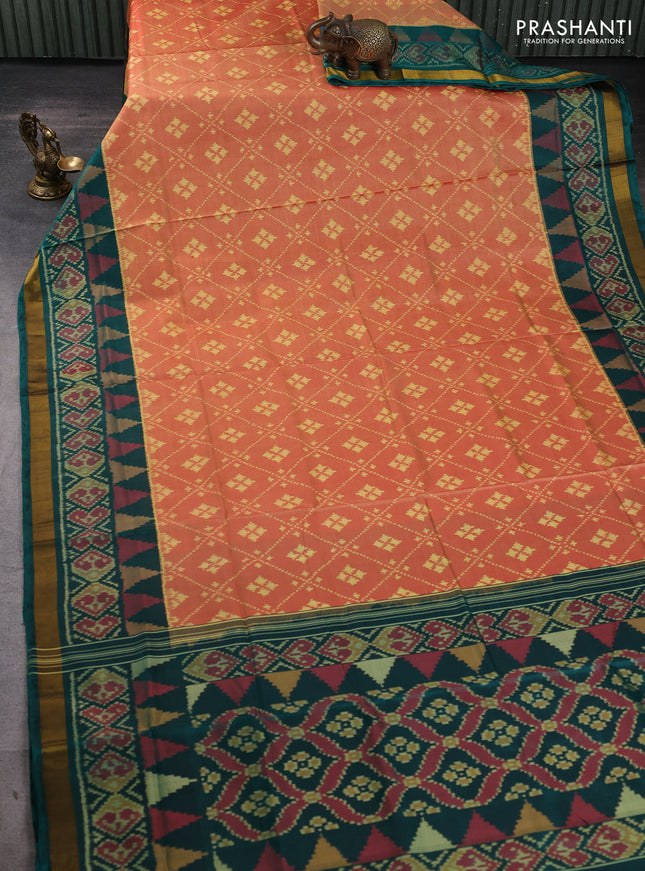 Rajkot patola silk saree sunset orange and bottle green with allover ikat woven buttas and ikat zari woven border