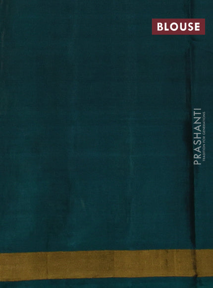 Rajkot patola silk saree sunset orange and bottle green with allover ikat woven buttas and ikat zari woven border
