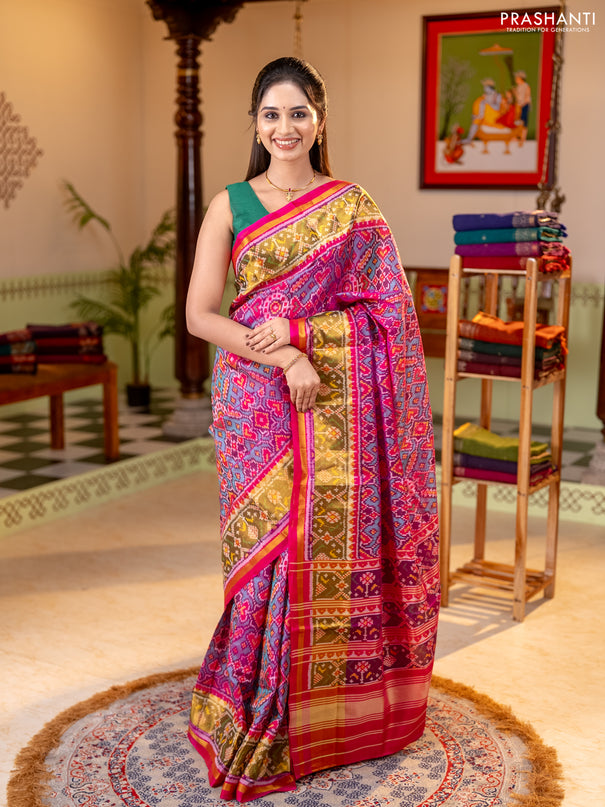 Rajkot patola silk saree dual shade of teal green and magenta pink with allover ikat weaves and ikat zari woven border
