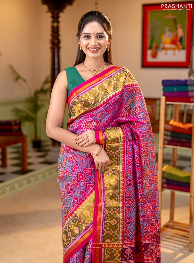 Rajkot patola silk saree dual shade of teal green and magenta pink with allover ikat weaves and ikat zari woven border