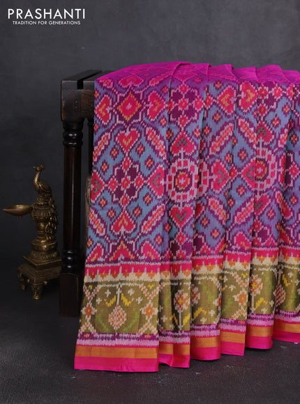 Rajkot patola silk saree dual shade of teal green and magenta pink with allover ikat weaves and ikat zari woven border
