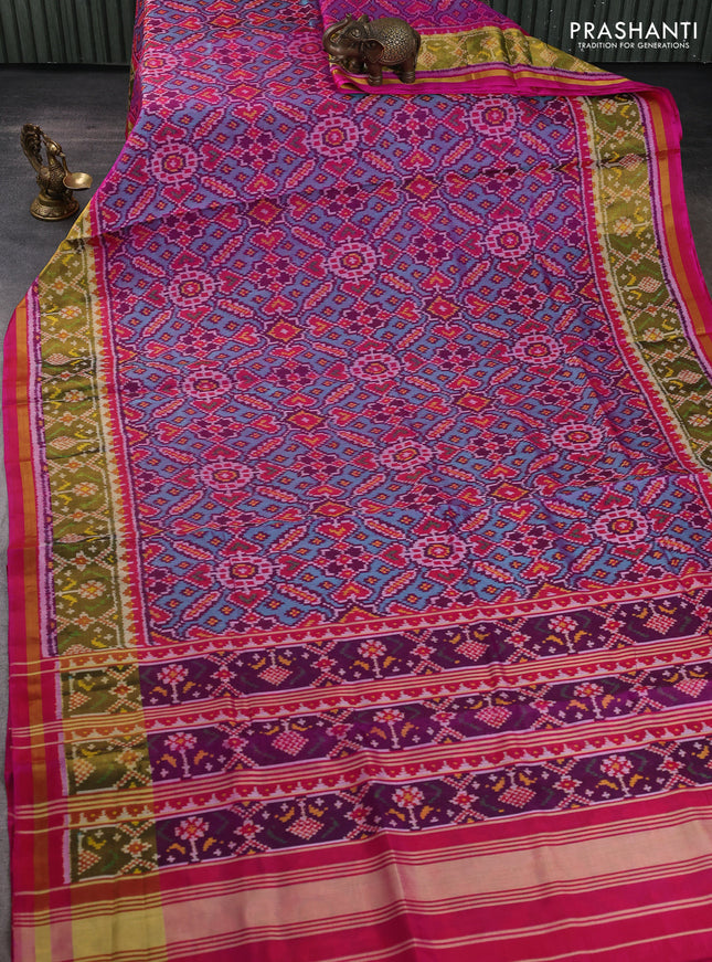 Rajkot patola silk saree dual shade of teal green and magenta pink with allover ikat weaves and ikat zari woven border