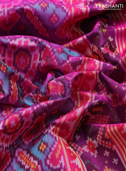 Rajkot patola silk saree dual shade of teal green and magenta pink with allover ikat weaves and ikat zari woven border