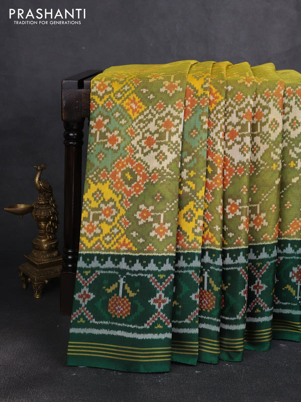 Rajkot patola silk saree mustard green and bottle green with allover ikat weaves and thread woven border