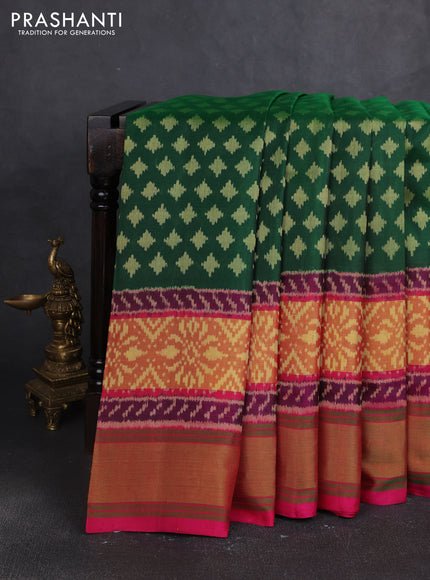 Rajkot patola silk saree bottle green and magenta pink with allover ikat woven buttas and zari woven border
