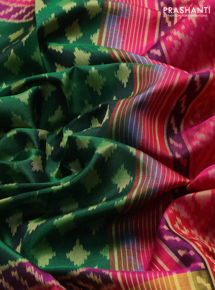 Rajkot patola silk saree bottle green and magenta pink with allover ikat woven buttas and zari woven border