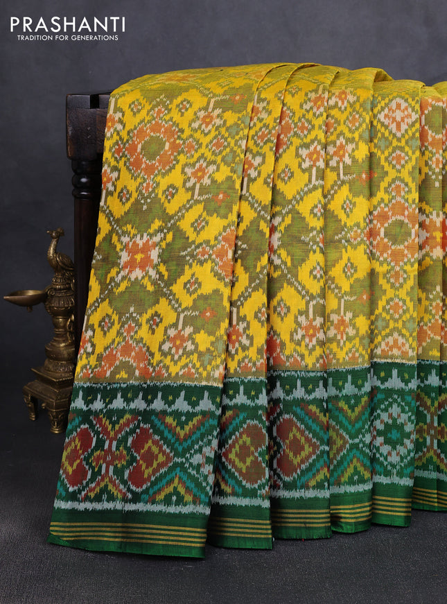 Rajkot patola silk saree yellow and green with allover ikat weaves and ikat woven simple border