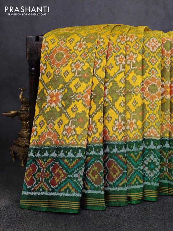 Rajkot patola silk saree yellow and green with allover ikat weaves and ikat woven simple border