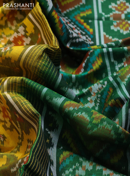 Rajkot patola silk saree yellow and green with allover ikat weaves and ikat woven simple border