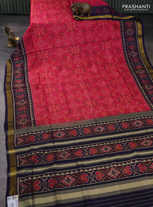 Rajkot patola silk saree peach pink and navy blue with allover ikat weaves and zari woven border