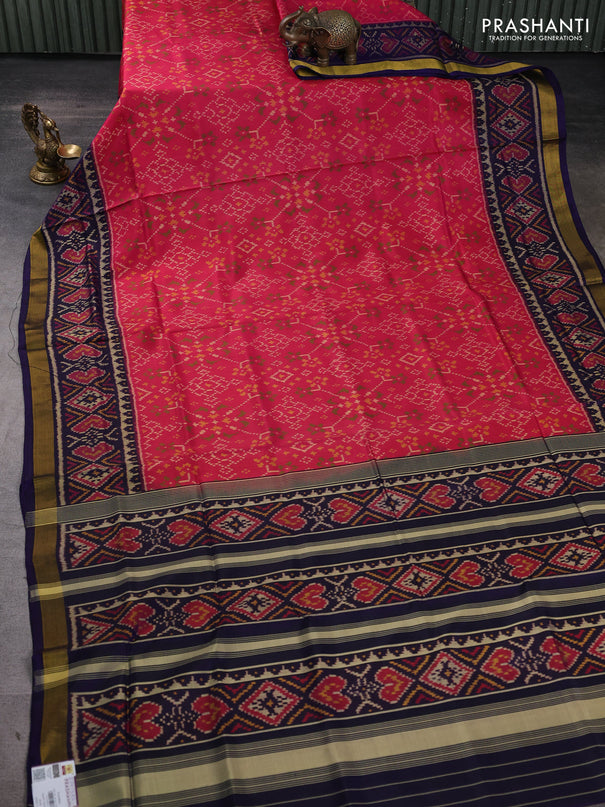 Rajkot patola silk saree peach pink and navy blue with allover ikat weaves and zari woven border