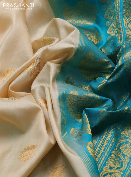 Pure gadwal silk saree cream and teal green with allover zari woven buttas and temple design zari woven border