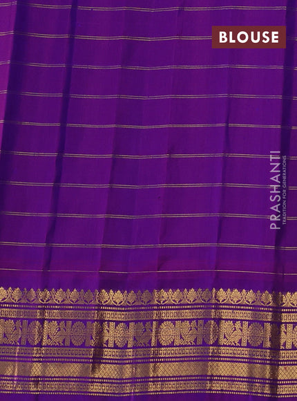 Pure gadwal silk saree blue and magenta pink with allover zari checks & buttas and zari woven border