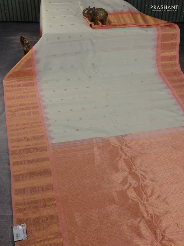 Pure gadwal silk saree cream and peach orange with silver & gold zari woven buttas and long temple design zari woven border